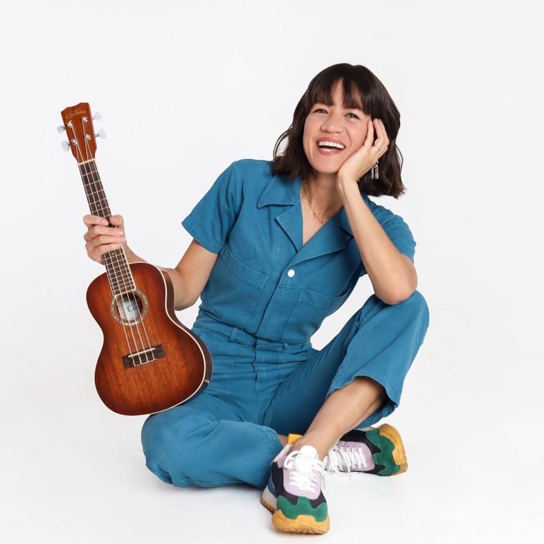 Miss Katie holding a ukulele