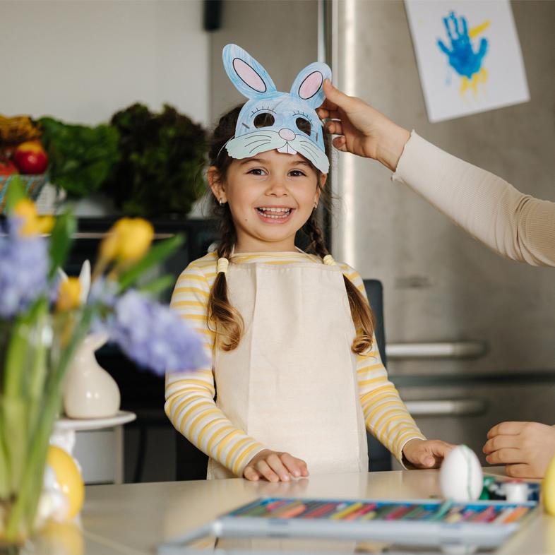 Young girl wearing bunny face headband