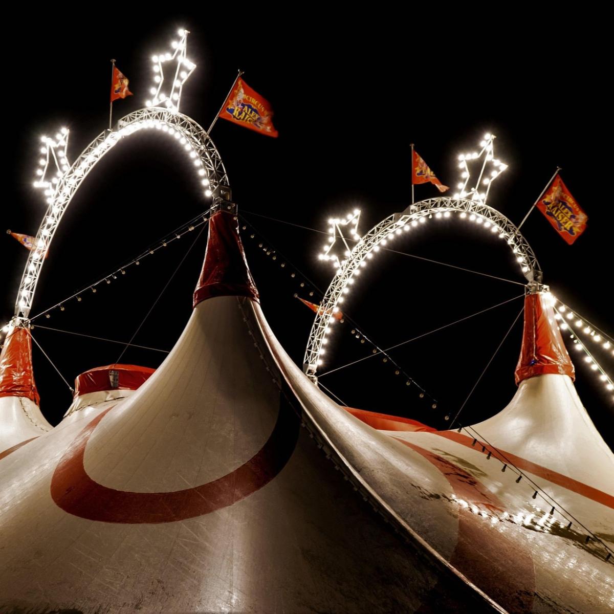 Night scene of circus tents with lights