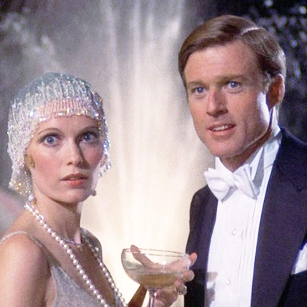 Robert Redford and Mia Farrow in 1920s era elegant costumes