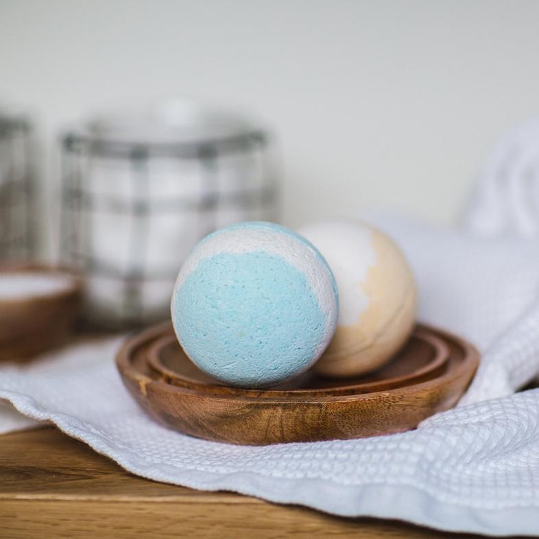 Bath bombs sitting on wood tray