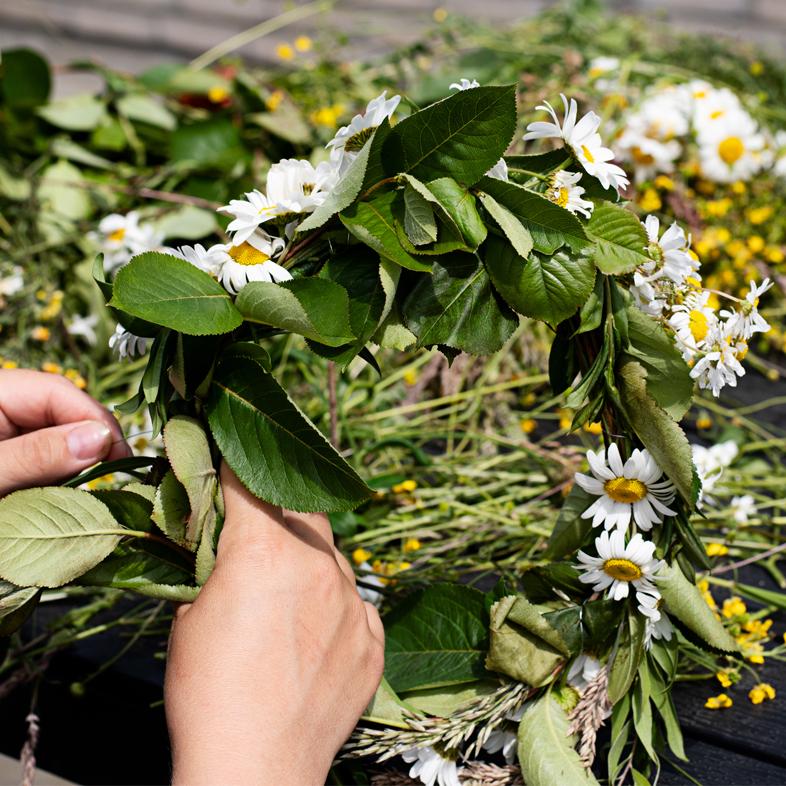 Shot of hands making a flower crown