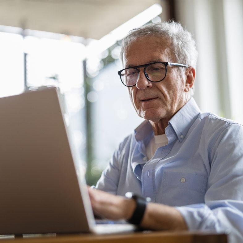 Senior working on a computer