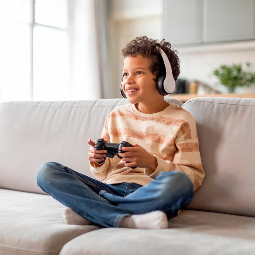 Young boy playing with videogames
