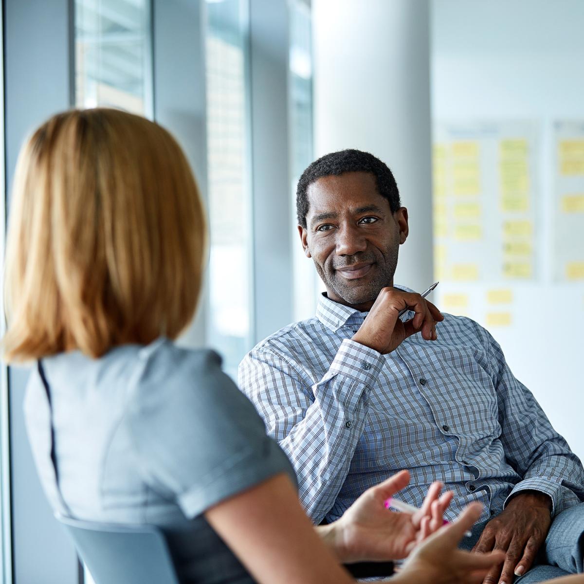 Two people sitting and talking