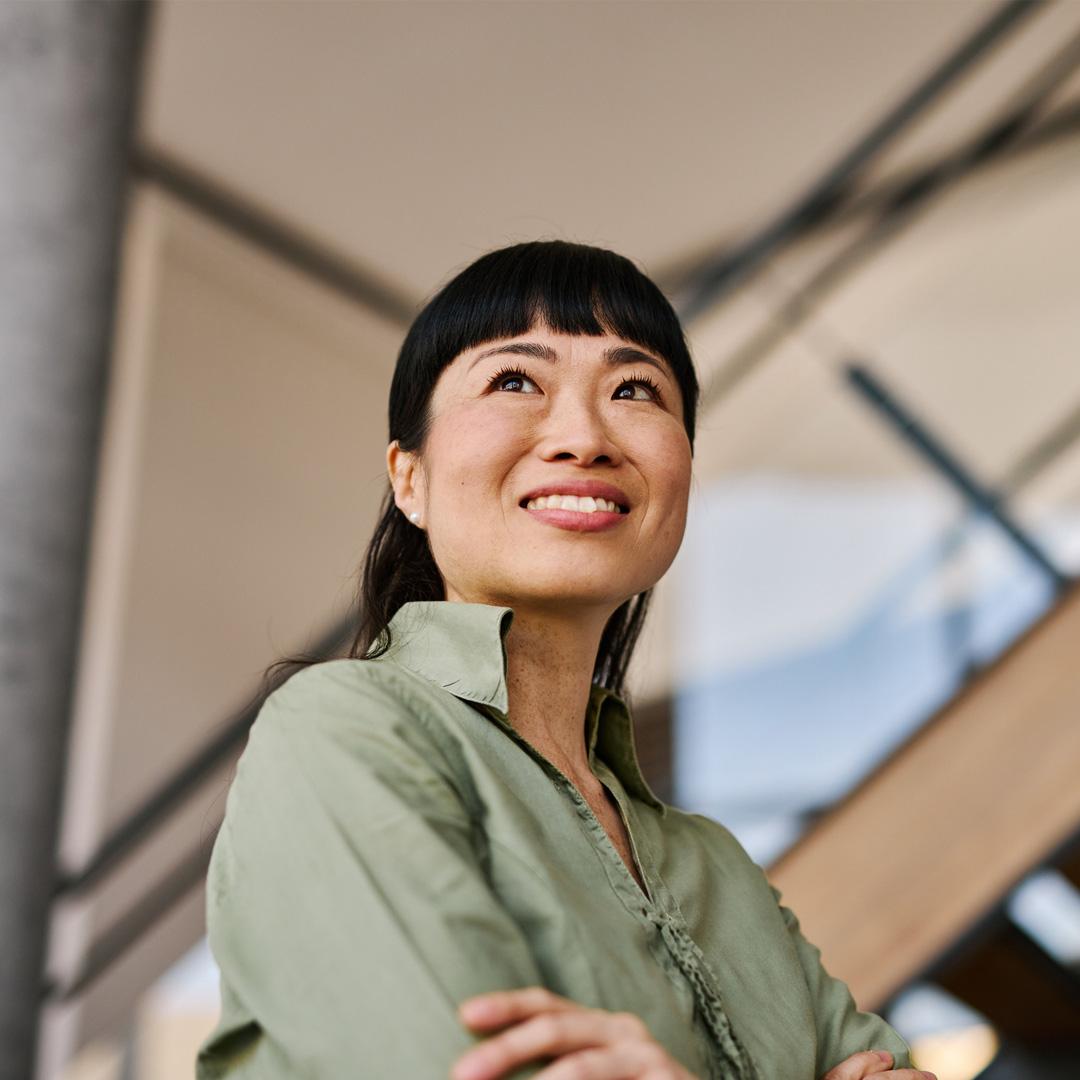 Business woman looking up smiling