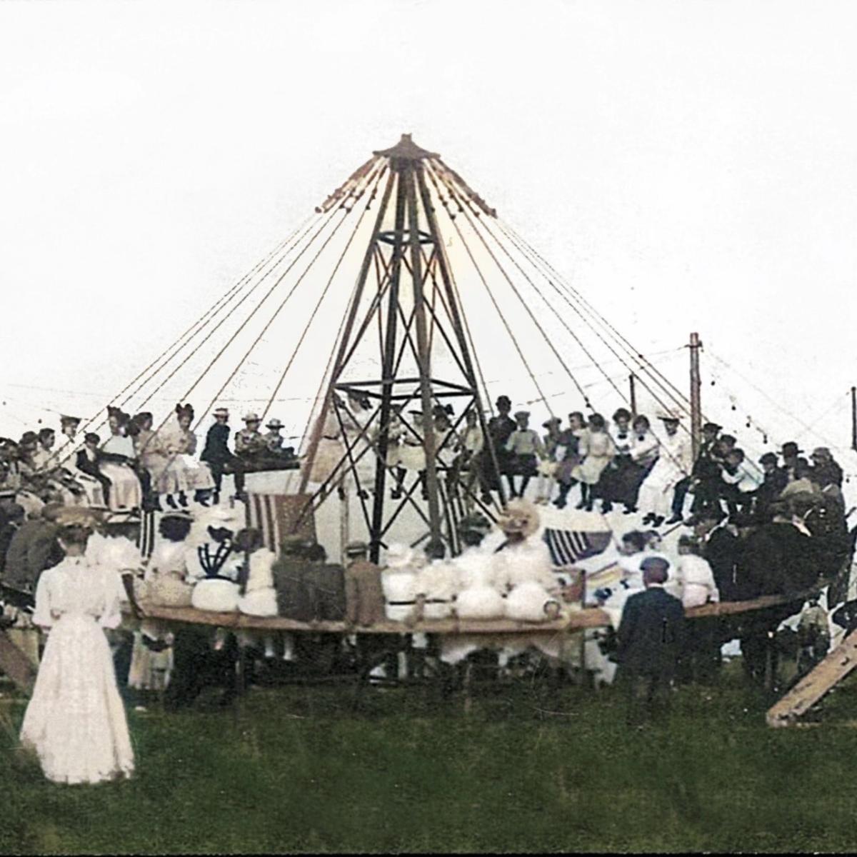 people in historical clothes on old fashioned amusement ride