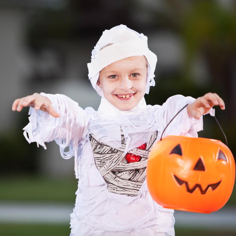 Child in mummy halloween costume