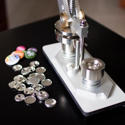 Button maker and parts to make buttons