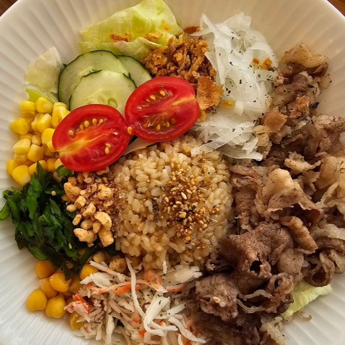 dish of grains, vegetables and meat