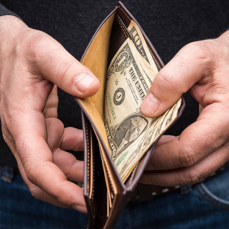 Hands opening a wallet