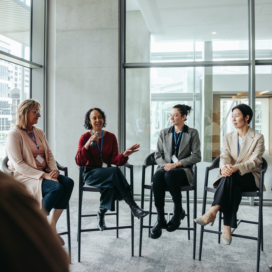 Panel of people looking at someone speaking