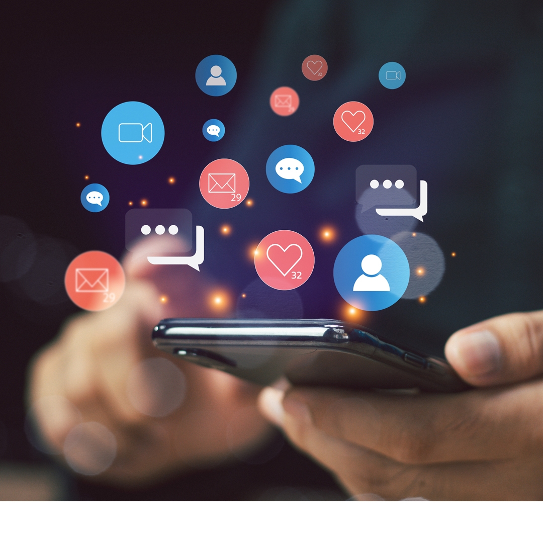 hand scrolling on phone with social media icons popping up