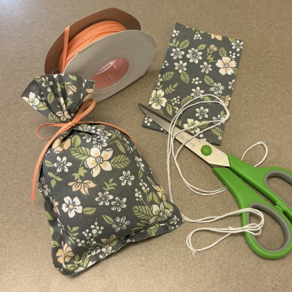 hand sewn sachet, scissors, ribbon, fabric and thread